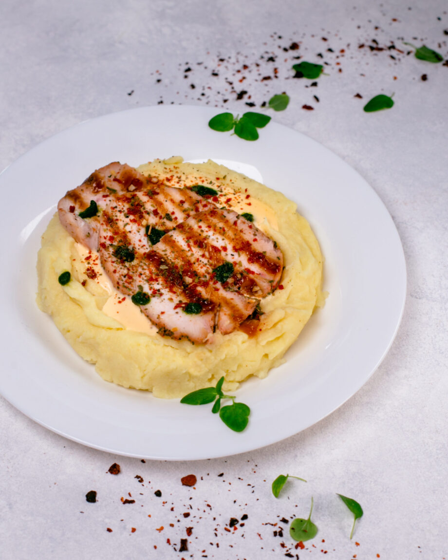 Chicken fillet with mashed potatoes and cheese sauce
